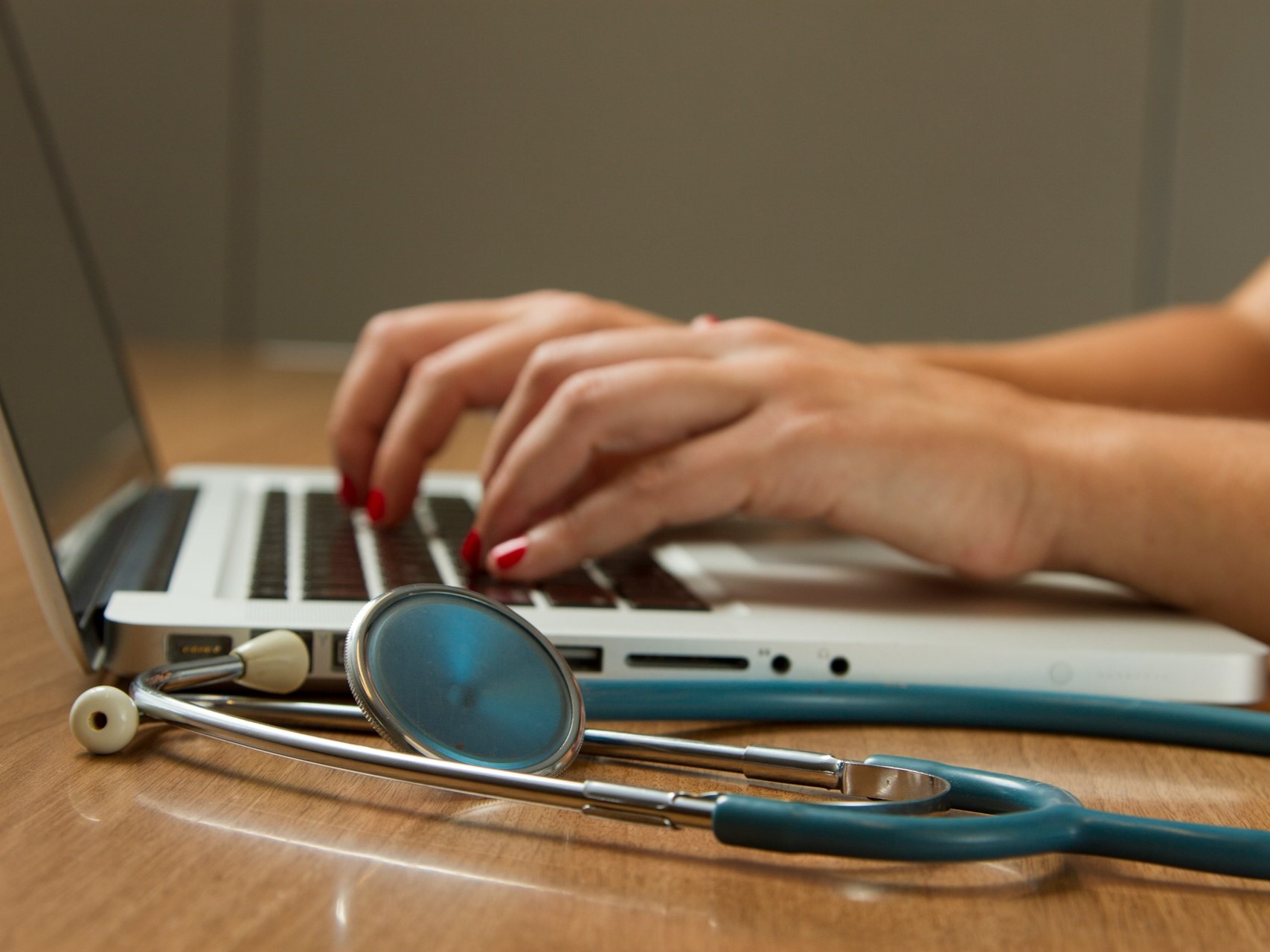 Doctor consulting with patient on a tablet